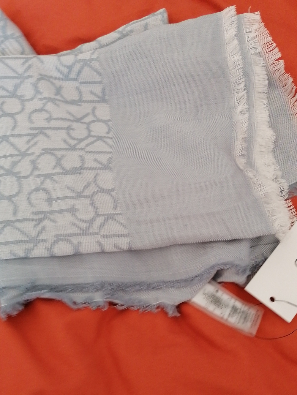 Calvin Klein Light Blue Rayon Fringe Scarf.Subtle woven texture, soft drape.